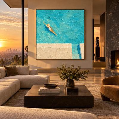 Drift Above the Pool Steps: above a taupe sofa with a dark stone table beside sunset glazing