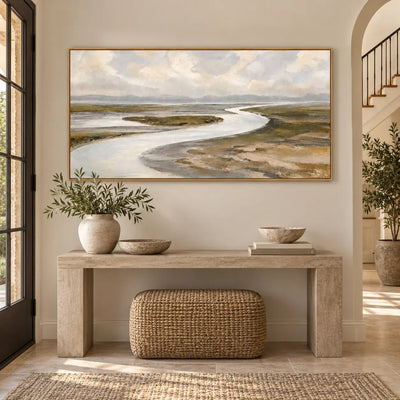 Estuary in Soft Weather above a long entry console with a woven stool and pale vase
