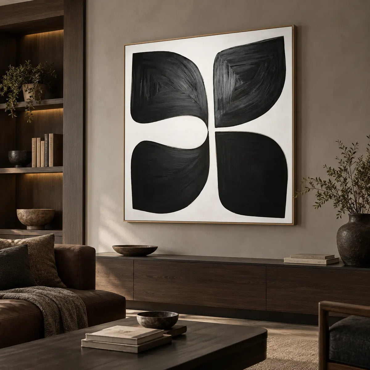 Four Forms Around a Pause: above a long dark wood cabinet beside a brown leather sofa and lit bookshelves