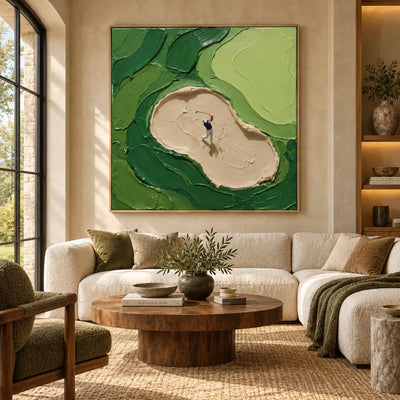 From the Sand above an ivory sofa with green cushions and a round wood table