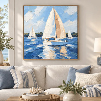 Full Sail in June above a cream sofa with blue cushions and a coral ornament on a coffee table