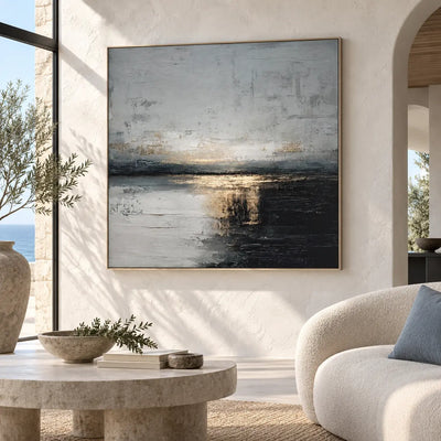 Gold at the Dark Waterline: beside a curved cream sofa with a blue cushion and sea-view window