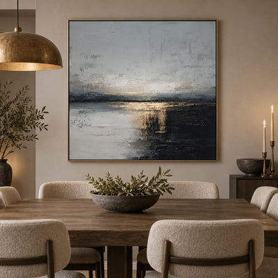 Gold at the Dark Waterline: behind a wood dining table beneath a brass dome pendant