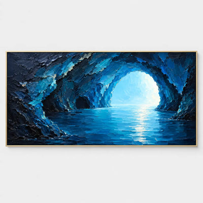 Inside the Blue Grotto: A dark sea cave opening onto turquoise light and rippling blue water