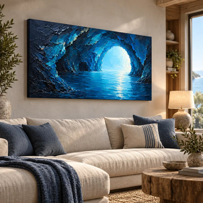 Inside the Blue Grotto: angled above a cream sectional beside an ocean view window