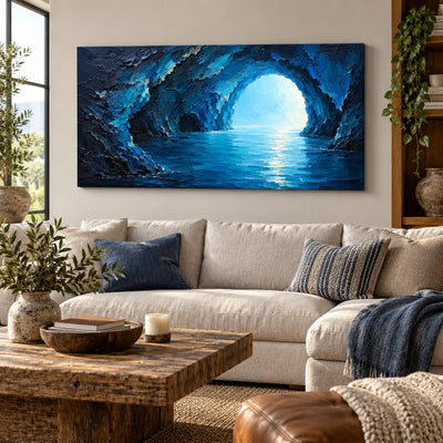 Inside the Blue Grotto: above a cream corner sectional with a leather ottoman in front