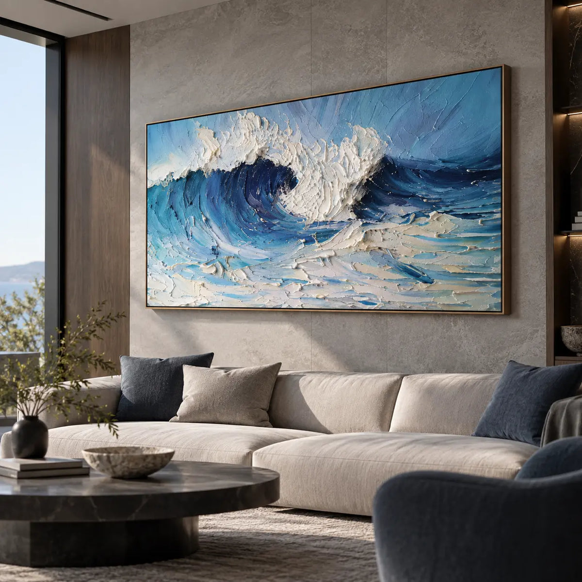 Inside the Turquoise Break: above a cream sectional beside a blue armchair and round dark table