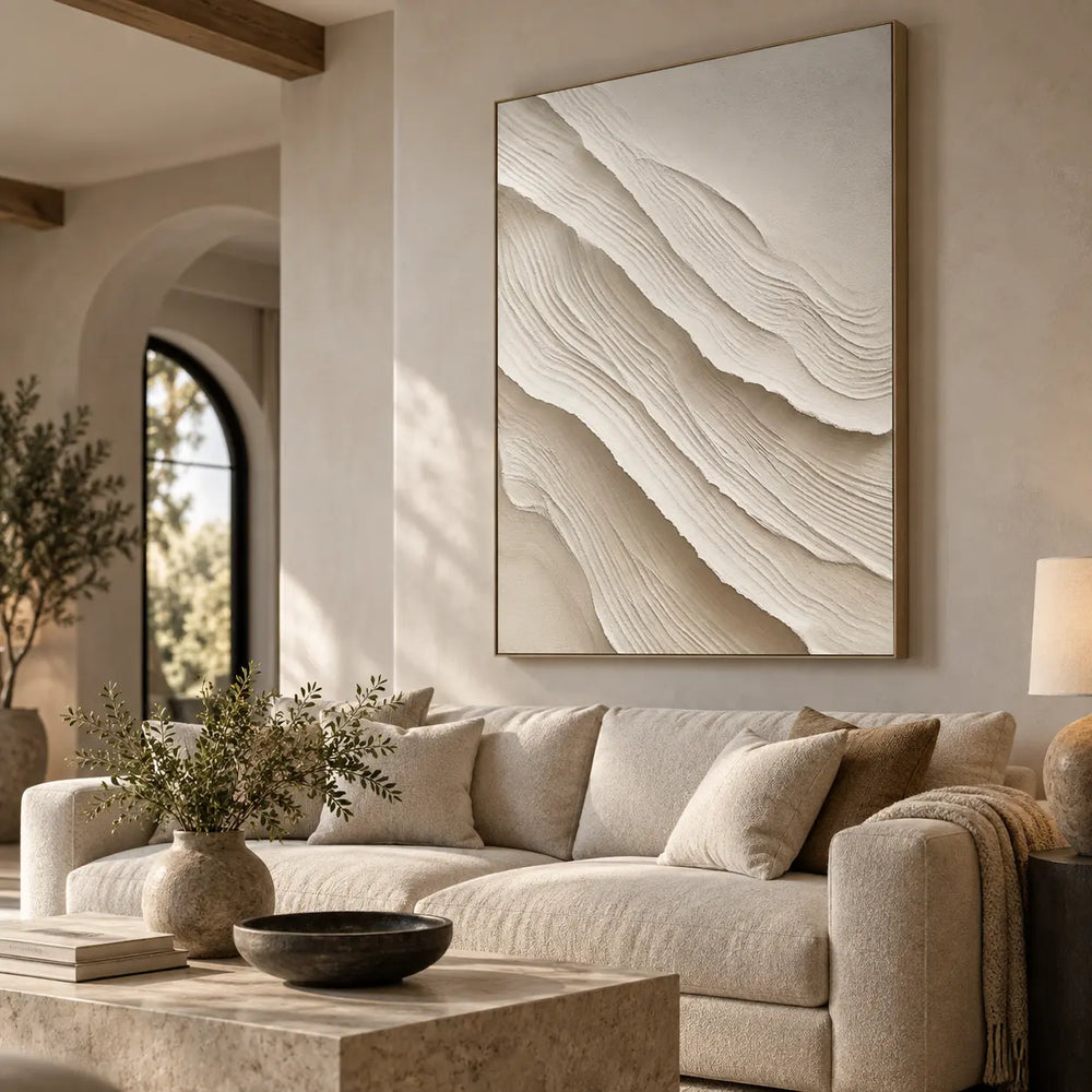 Folds Descending: textured canvas artwork above a sofa behind a square stone coffee table.