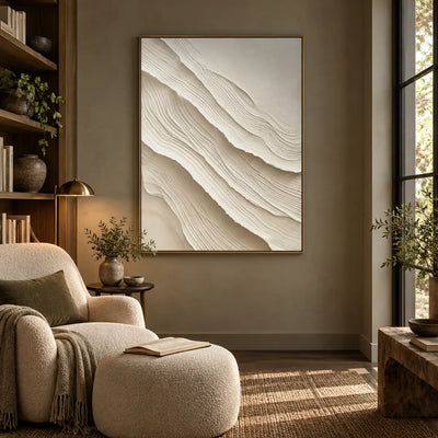 Ivory Folds Descending: beside a cream reading chair and matching ottoman in a wood-lined nook