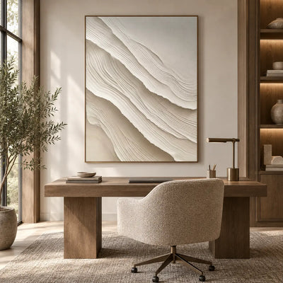 Ivory Folds Descending: above a wood desk with a cream swivel chair and brass task lamp