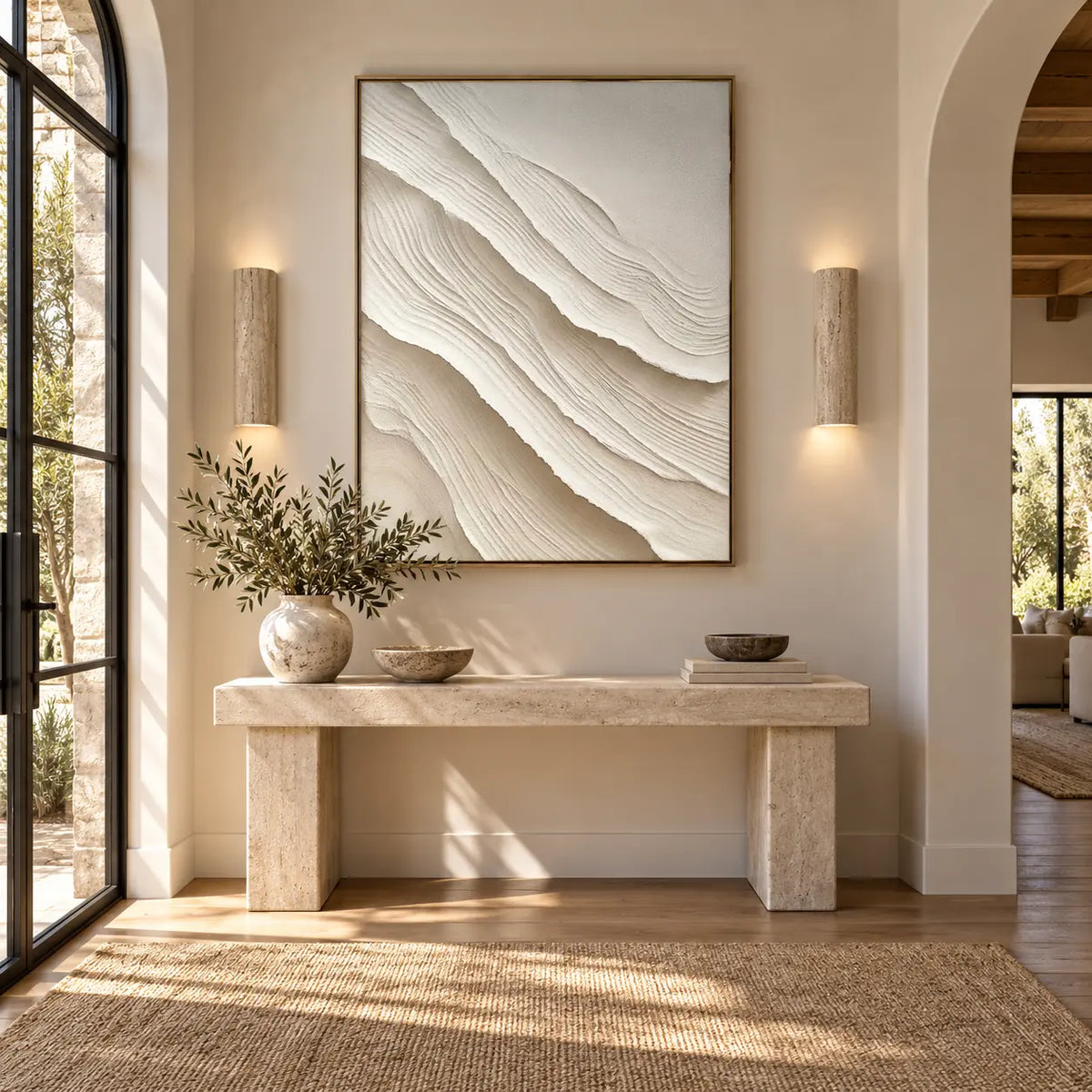 Ivory Folds Descending: above a stone entry console between two cylindrical wall lights