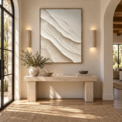 Ivory Folds Descending: above a stone entry console between two cylindrical wall lights