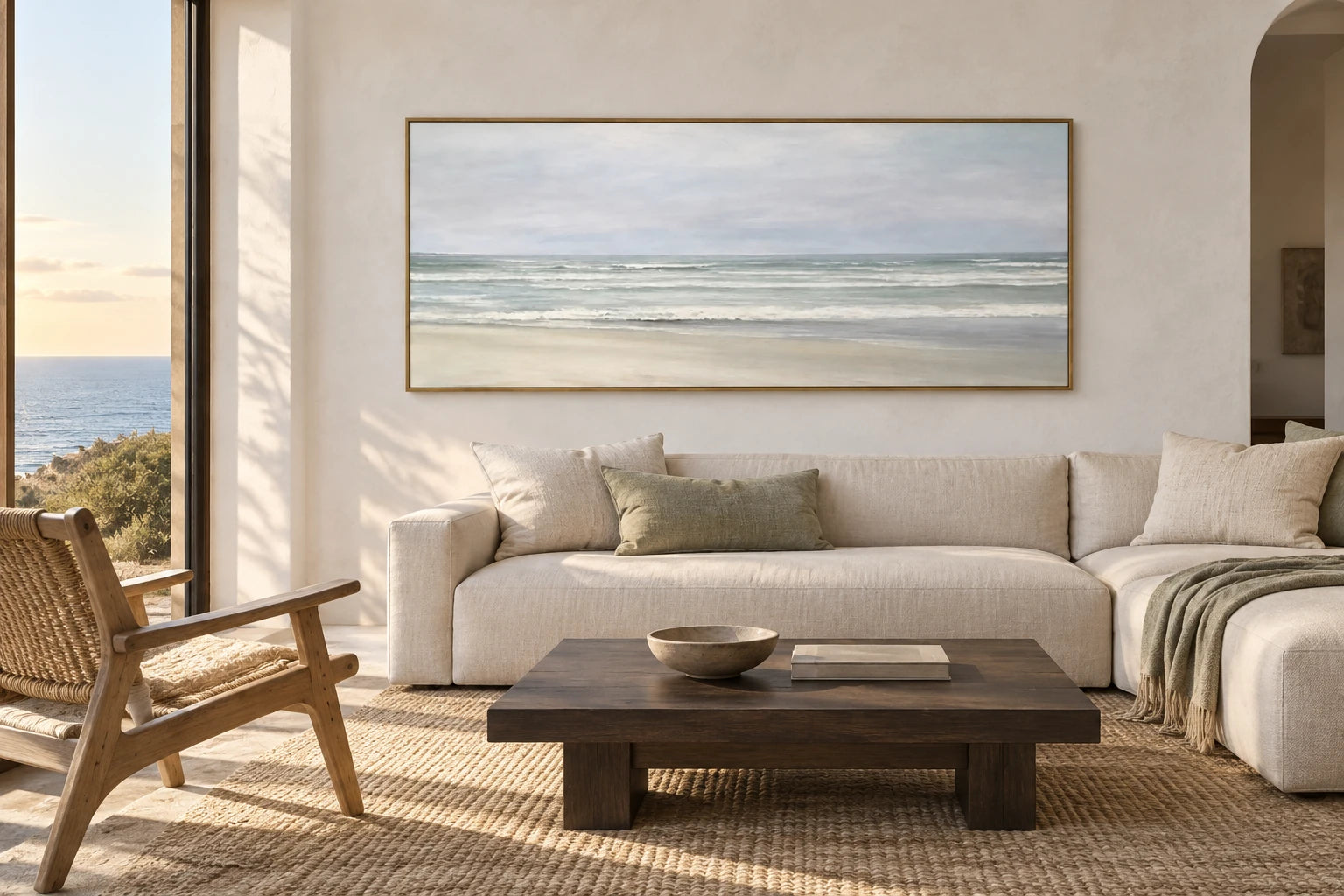 A soft coastal living room with The Shore in Silver Light above a linen sofa