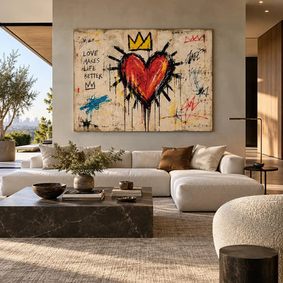 Love Makes a Crown: artwork above a white sectional overlooking a garden with a dark coffee table