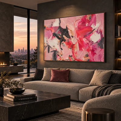Magenta Turning on the Right: above a taupe sectional with a rose cushion beside sunset glazing