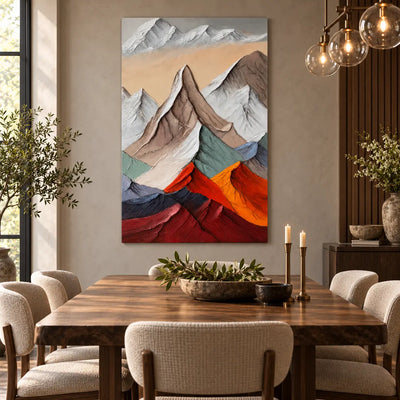 Peaks Above the Ember Range: behind a wood dining table beneath glass globe lights