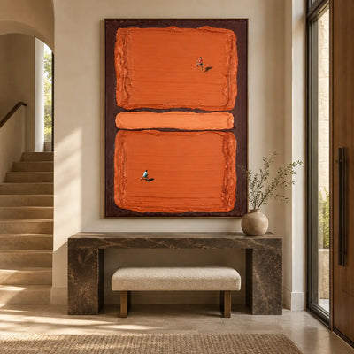 Rally in Burnt Orange: above a dark stone entry console with a cream bench underneath