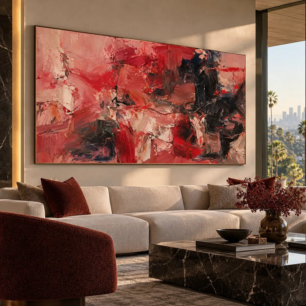 Red Fragments Around a Dark Knot: above a pale sectional beside a red armchair and marble table