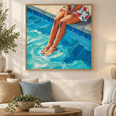 Ripples at Noon above a cream sofa with blue and tan cushions and a round wood table