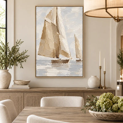 Sails in Soft Light over a wood dining sideboard beside slender candles and a ring pendant
