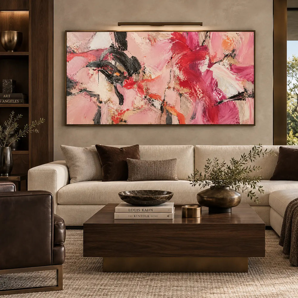 Scarlet Sweeps in Open Pink: beneath a picture light above a cream sofa and wooden table