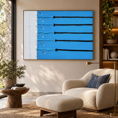 Six Lanes from the Edge: above a cream reading chair and ottoman beside wood shelves