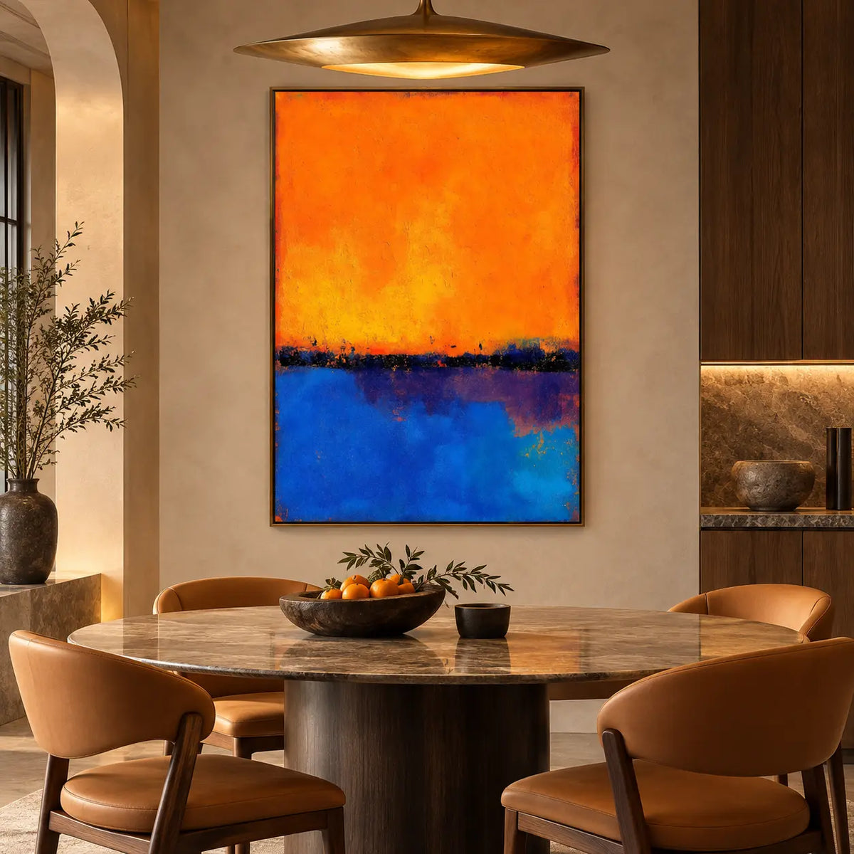 Tangerine over Ultramarine: behind an oval dining table and tan chairs beneath a brass pendant