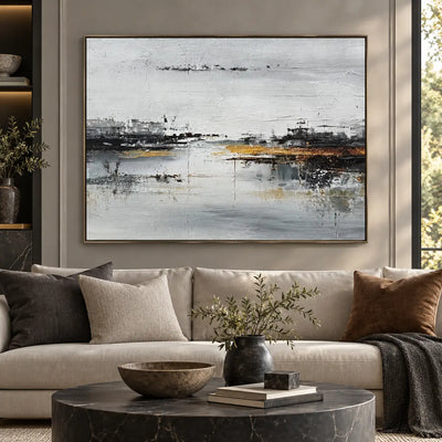 The Amber Quay: above a cream sofa with charcoal cushions and a round dark marble table