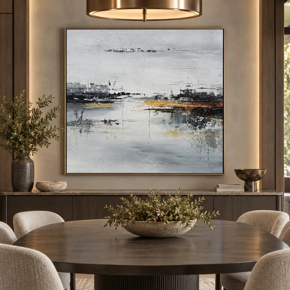 The Amber Quay: behind an oval wood dining table beneath a brass ring pendant