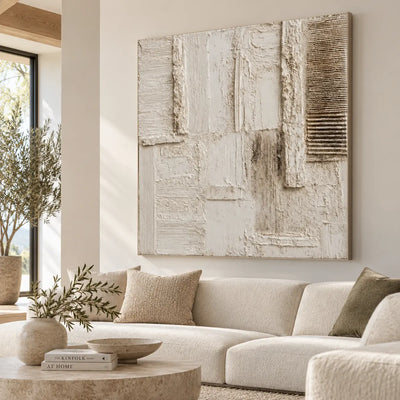 The Chalkwork Grid: above a cream sofa behind a round pale stone table