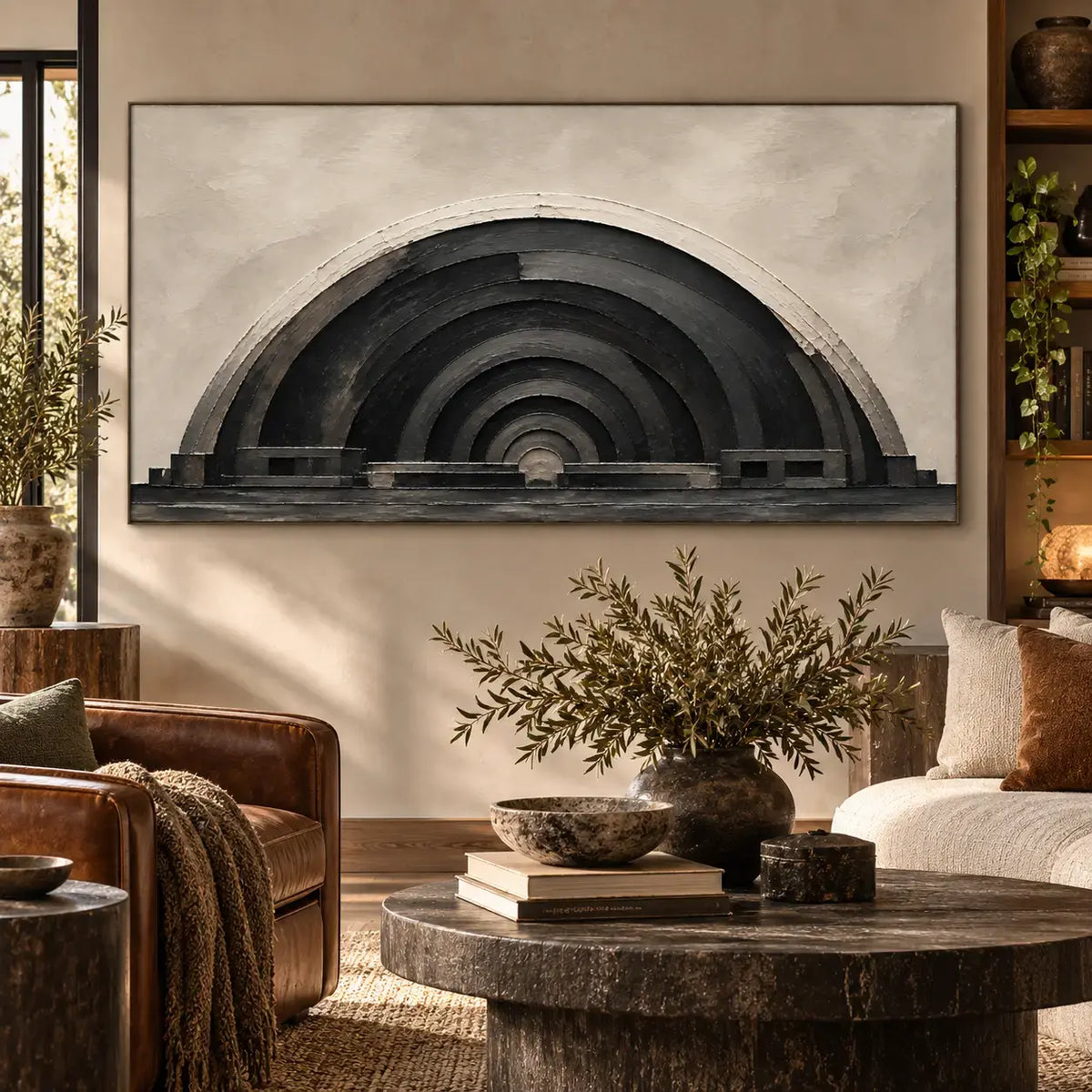 The Charcoal Arcade: between a leather chair and cream sofa behind a dark round table