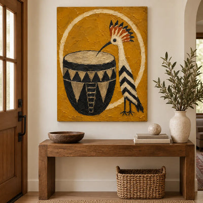 The Crested Drummer: above a wood console with a basket below and a pale vase at right