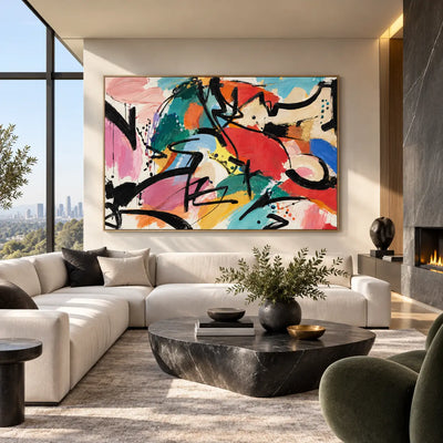 The Curve That Cuts Back: above a white sectional with an oval dark stone table and green chair