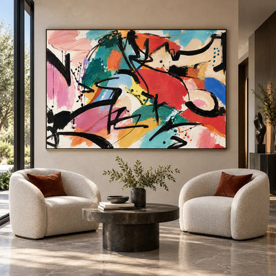 The Curve That Cuts Back: above two rounded white armchairs and a circular dark table