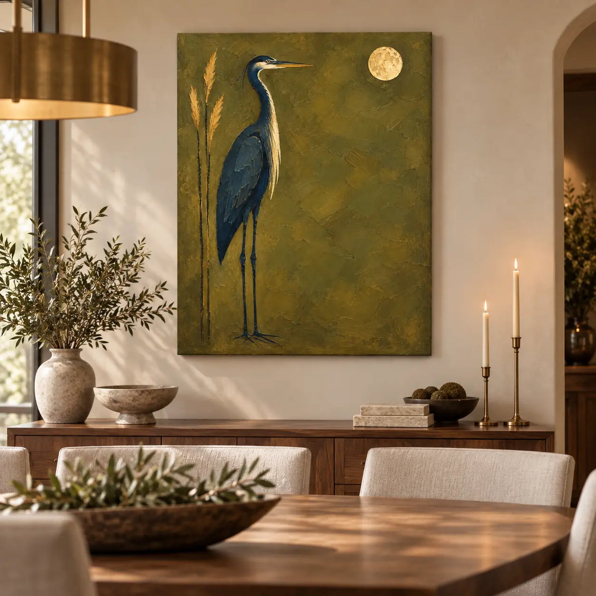 The Heron’s Golden Hour: above a dining sideboard with slender brass candles