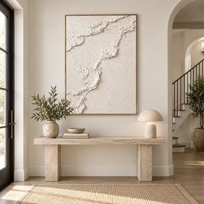 The Ivory Ascent: above a pale stone console beside an arched staircase opening