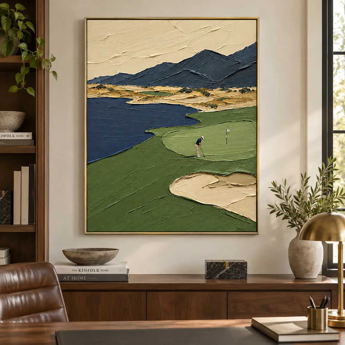 The Putt Beneath Blue Peaks: above a wood office cabinet behind a desk and leather chair