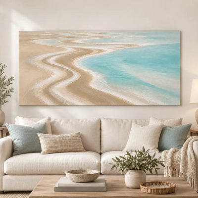 The Shore Draws a Curve: above a cream sofa with pale aqua cushions and a light wood table