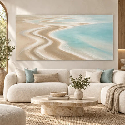 The Shore Draws a Curve: above a curved cream sofa and round pale stone table