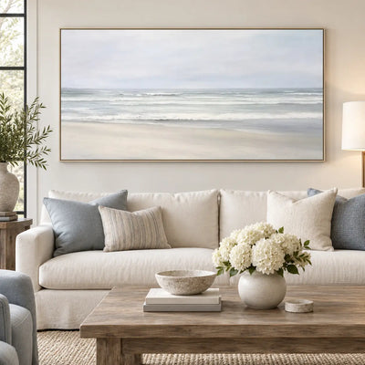 The Shore in Silver Light: over a white sofa with blue cushions and hydrangeas on a wood table