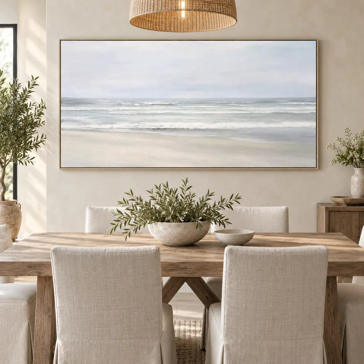 The Shore in Silver Light: behind a pale wood dining table under a woven pendant