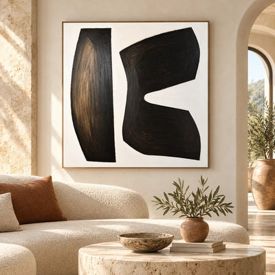 The Space Between Forms: above a curved ivory sofa beside a sunlit archway
