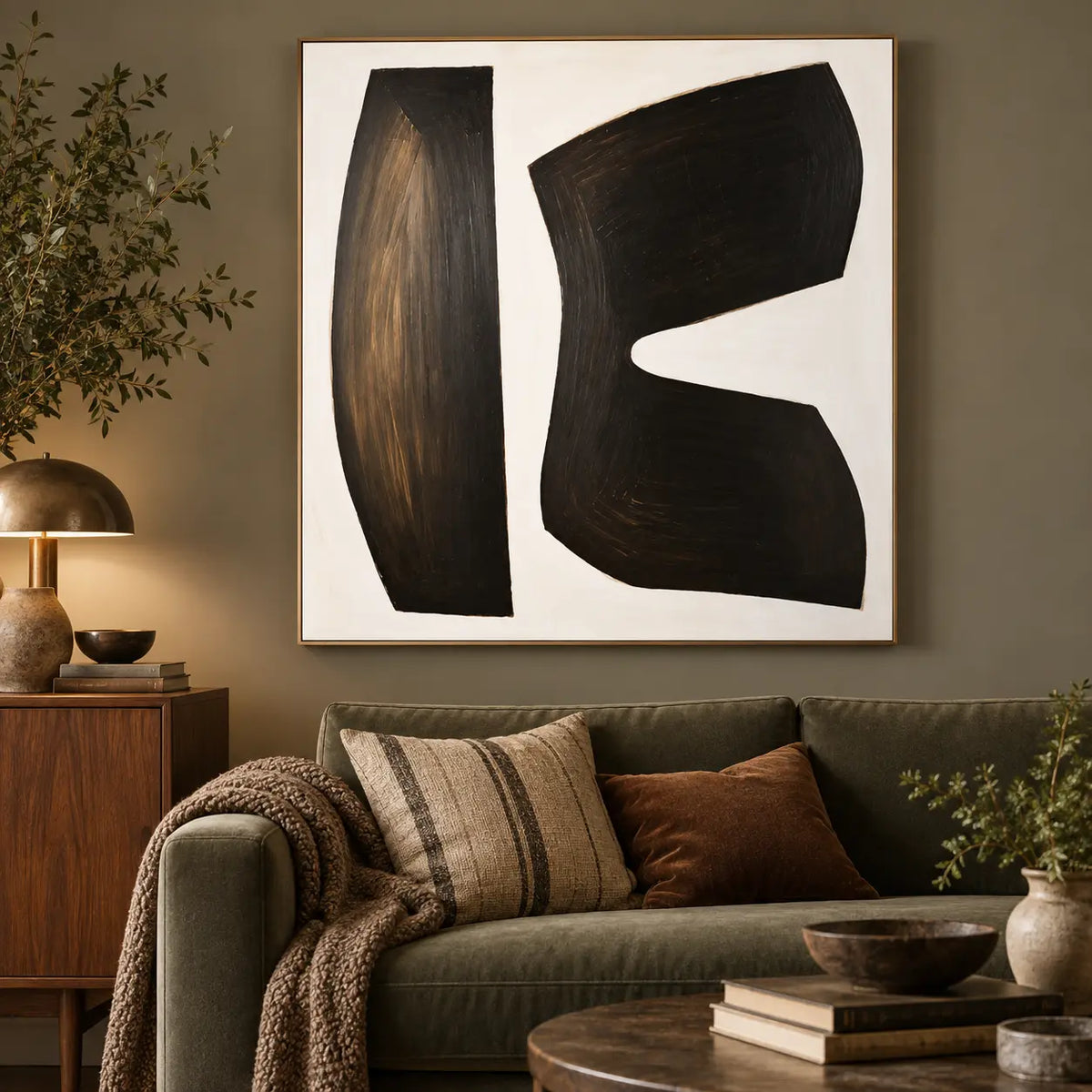 The Space Between Forms: above an olive sofa beside a wooden cabinet and brass lamp