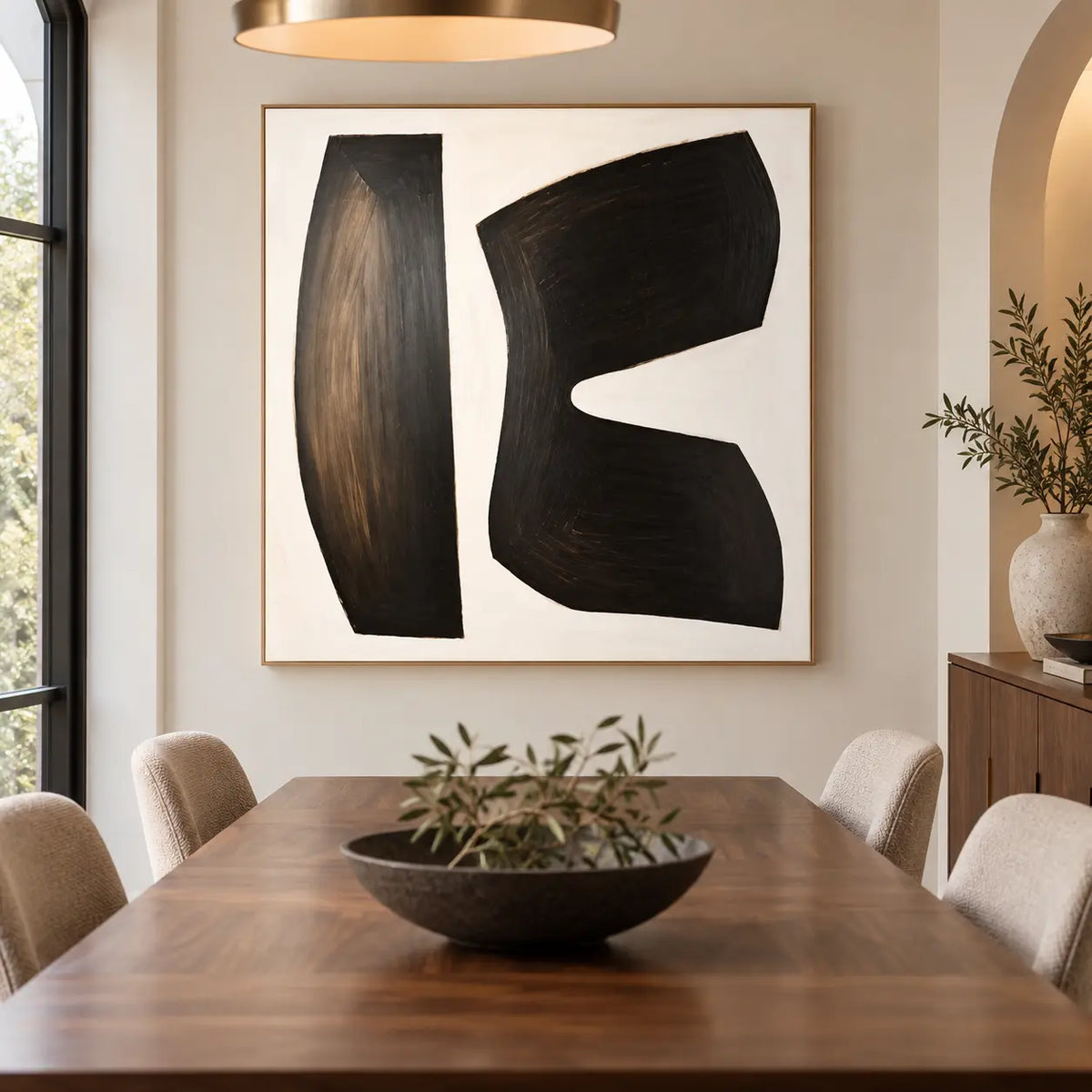 The Space Between Forms: behind a wooden dining table with a low black bowl