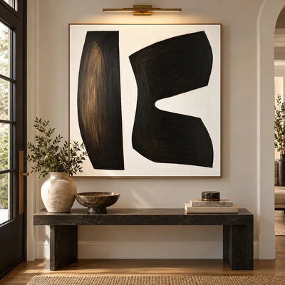 The Space Between Forms: above a dark stone console beneath a slim picture light