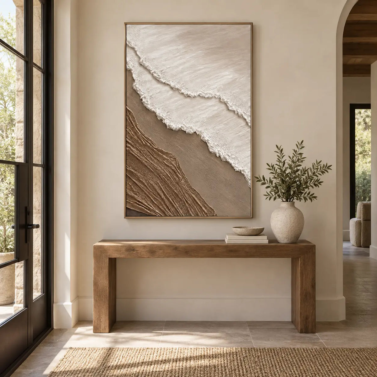 The Umber Shoreline: above a wood entry console beside glass doors and an arch