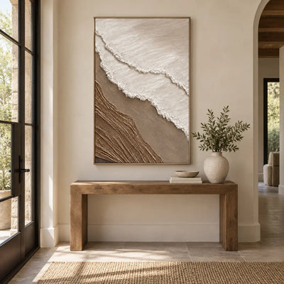 The Umber Shoreline: above a wood entry console beside glass doors and an arch