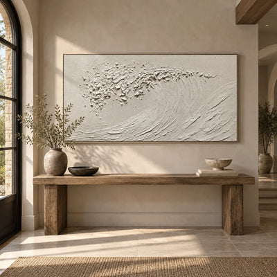 The Uncolored Breaker: above a long wood entry console beside an arched glass door