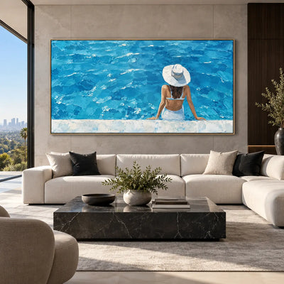 The Wide Blue Afternoon: above a cream sectional and square black marble table
