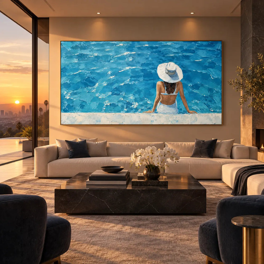 The Wide Blue Afternoon: above a long cream sofa beside a sunset view